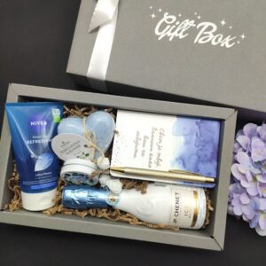 poklon set sa belim šampanjcem kozmetikom NIVEA i notesom Svet je tvoj u Gift Box kutiji